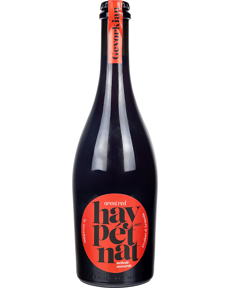 Bottle of Hay Pet Nat Areni Red 2022 by Gevorkian Winery featuring a bold red label and crown cap, standing against a white background.