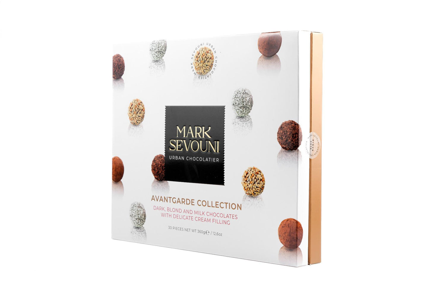 Mark Sevouni Avantgarde Collection box – 30-piece assortment of dark, blond, and milk chocolate truffles with cream filling, elegantly packaged for gifting.
