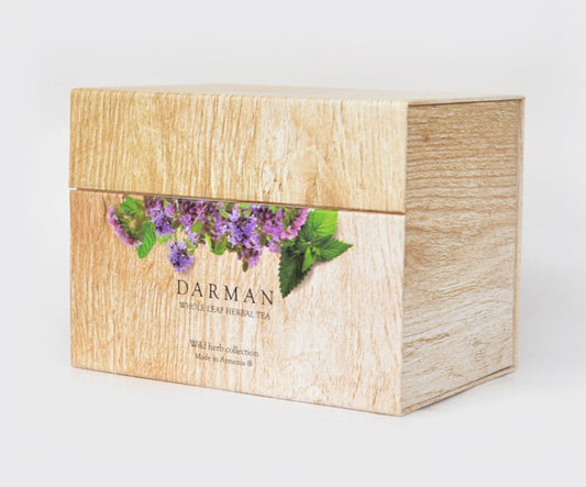 Closed Darman Specialty Herbal Tea: Organic Collection Box with floral illustration and wooden texture.