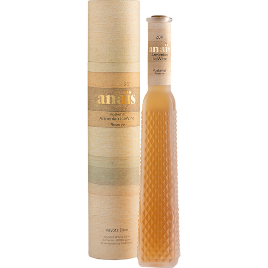 Anaïs Armenian Ice Wine Voskehat 2011 – elegant amber-colored dessert wine in a diamond-textured tall bottle next to its cylindrical beige and gold gift box.