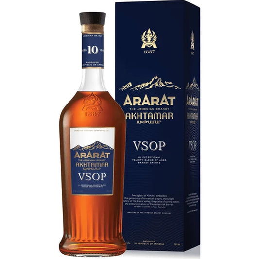 Bottle and box of ARARAT Akhtamar 10-Year-Old Armenian brandy featuring navy blue and gold design with mountain imagery.