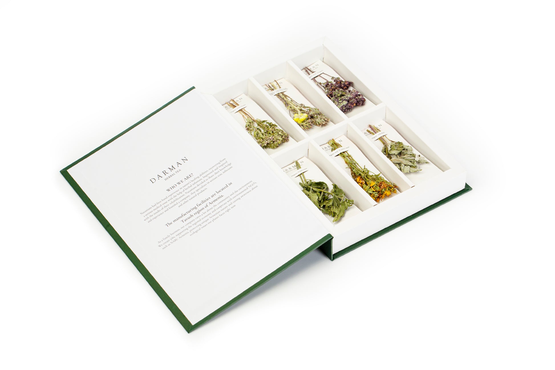 Angled view of Darman Green Book tea gift box with six artisan herb bundles