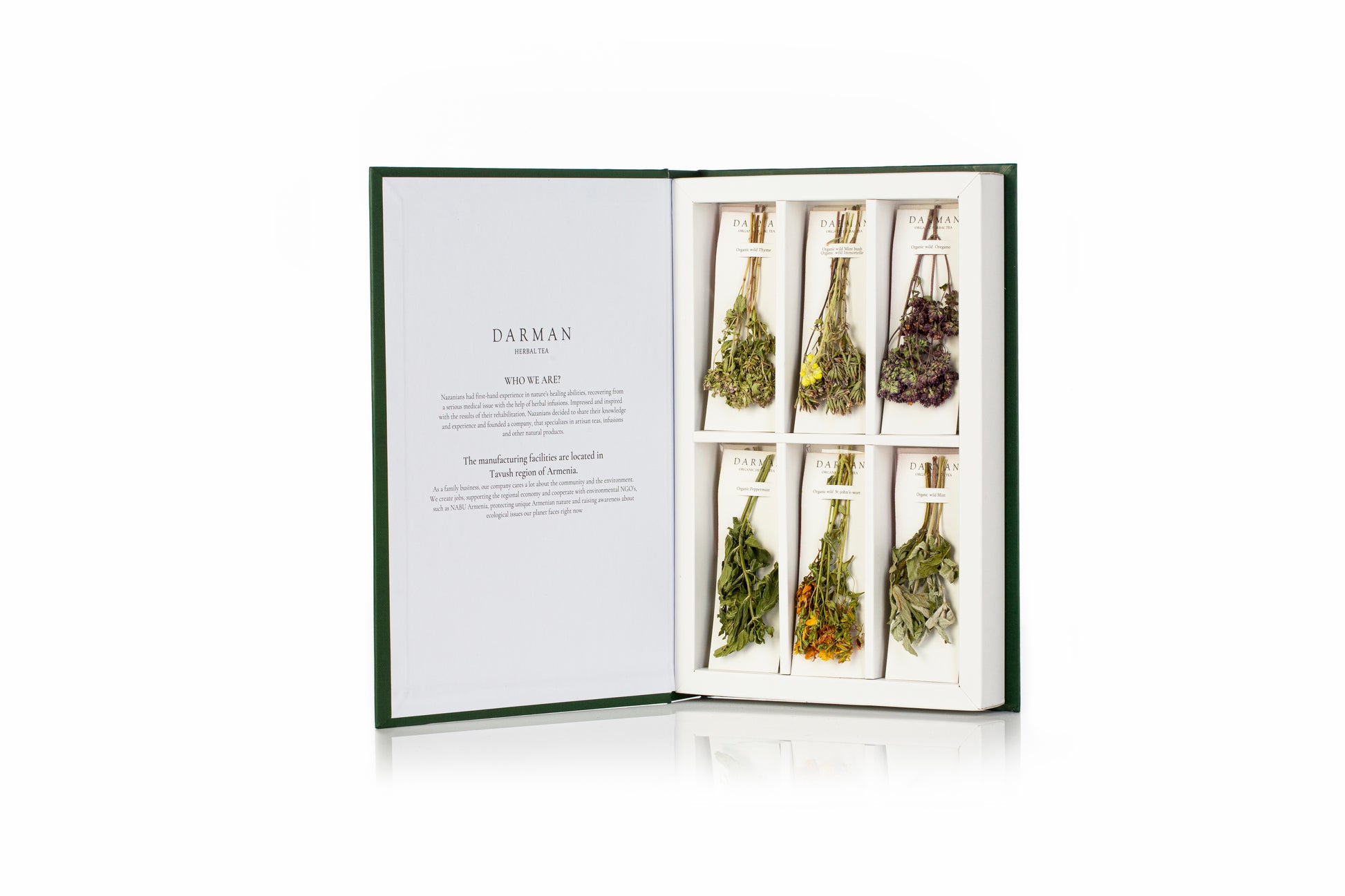 Darman Green Book herbal tea set opened flat with six dried herbal bouquets and brand story