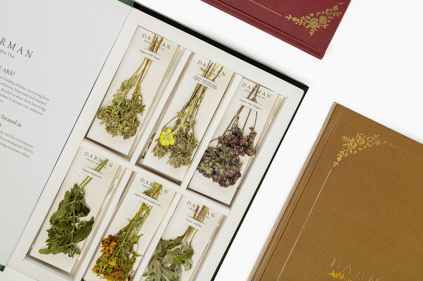 Close-up of Darman Green Book tea box with labeled organic herbs and decorative covers