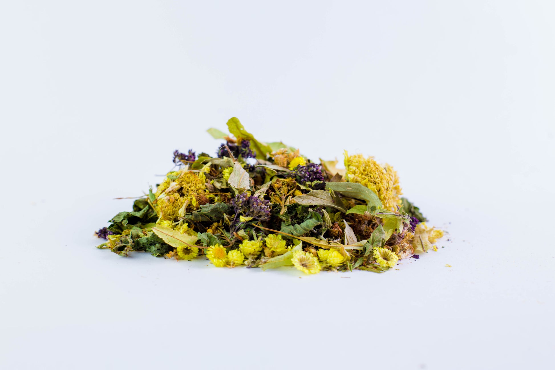 Colorful loose leaf blend of Darman Morning Mood herbal tea on white background