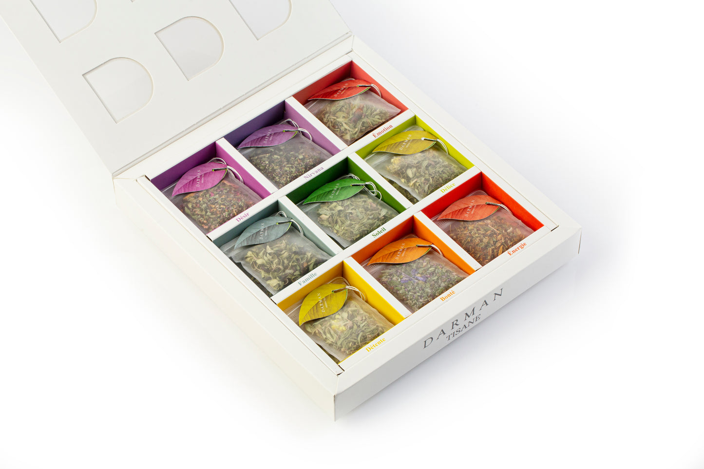 Detailed close-up of Darman Herbal Tea compartments featuring vivid tea bag tags named Soleil, Famille, Émotion, and more.