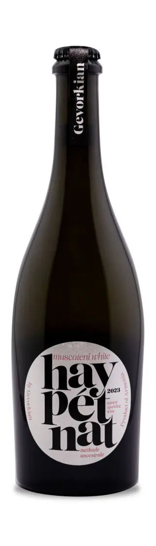 Bottle of Hay Pet Nat Muscateni White 2023 by Gevorkian Winery, featuring a modern white and pink label with a crown cap and vertical Gevorkian branding on the neck.