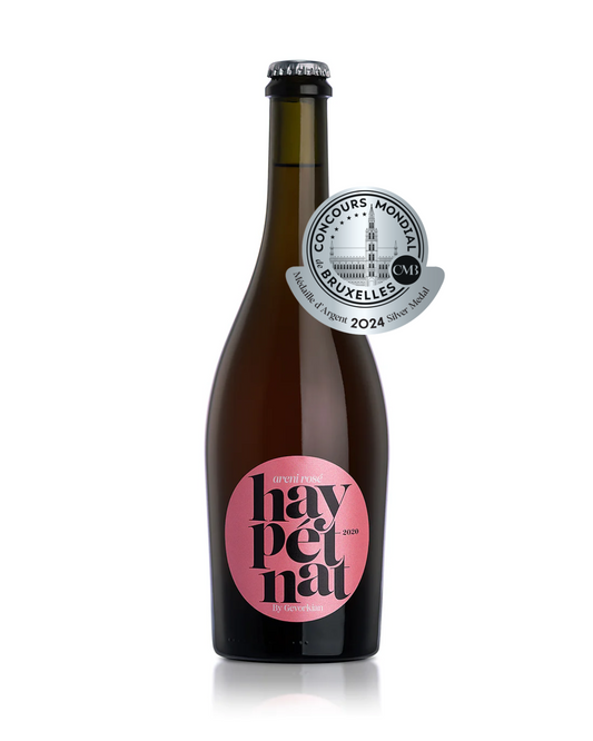 Bottle of Hay Pet Nat 2020 Areni Rosé by Gevorkian Winery with a metallic pink label and crown cap, displayed on a white background.