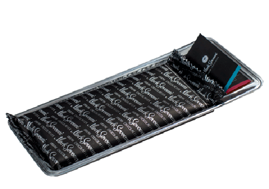 Alt Text:
Premium gift tray of Mark Sevouni Urban Chocolatier chocolate bars wrapped in branded black foil, partially opened to reveal individually packed pieces.