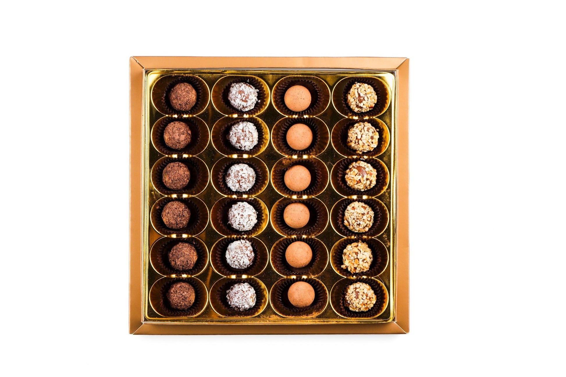 Open box view of Mark Sevouni Avantgarde Collection chocolates with cocoa, coconut, hazelnut, and chocolate coatings