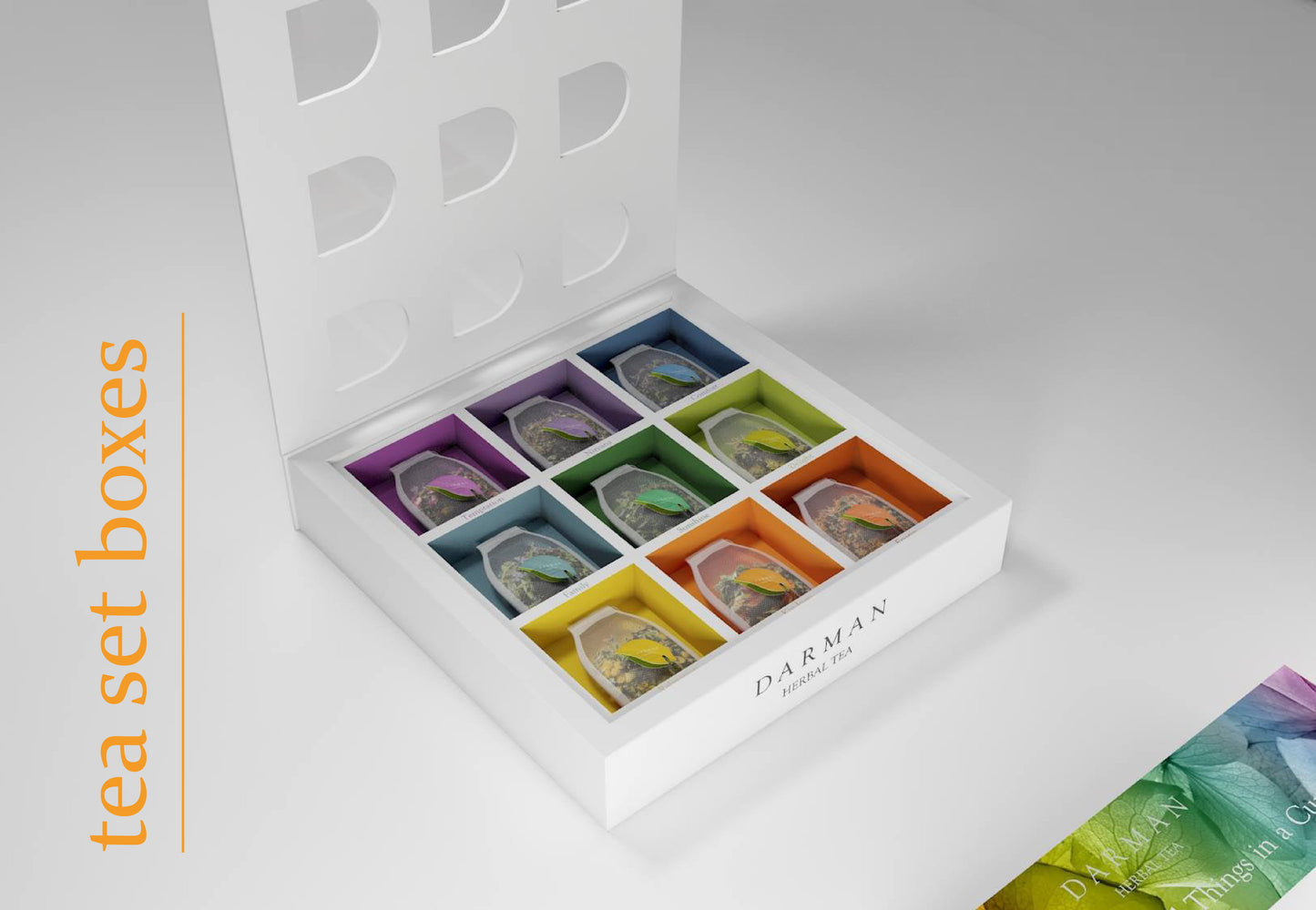 Tea box fully open, highlighting nine vibrant tea sachets arranged in color-coded compartments, with the interior of the lid visible above.