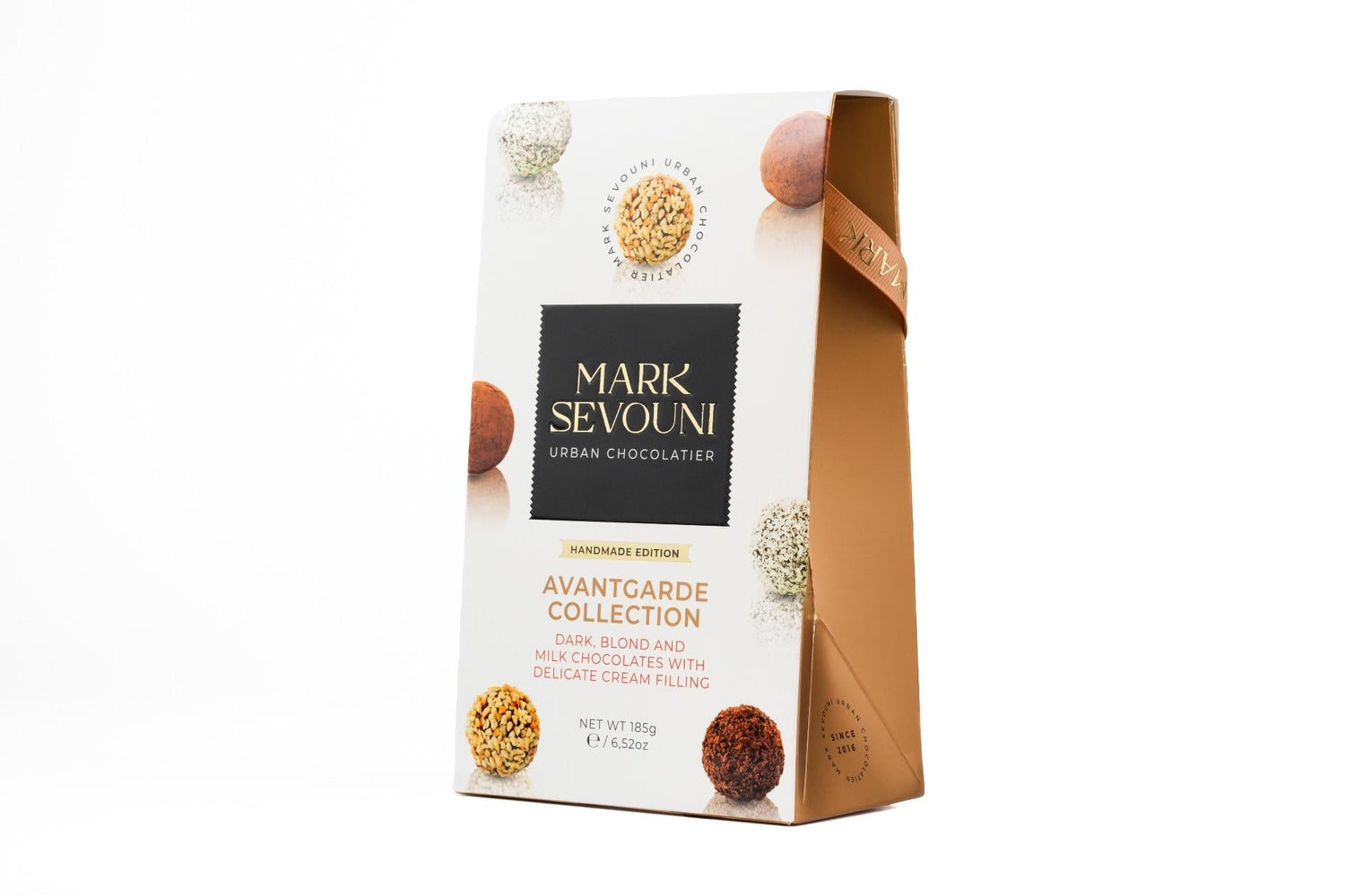 Mark Sevouni Avantgarde Collection chocolate truffle gift box – handmade dark, blond, and milk chocolates with delicate cream filling.