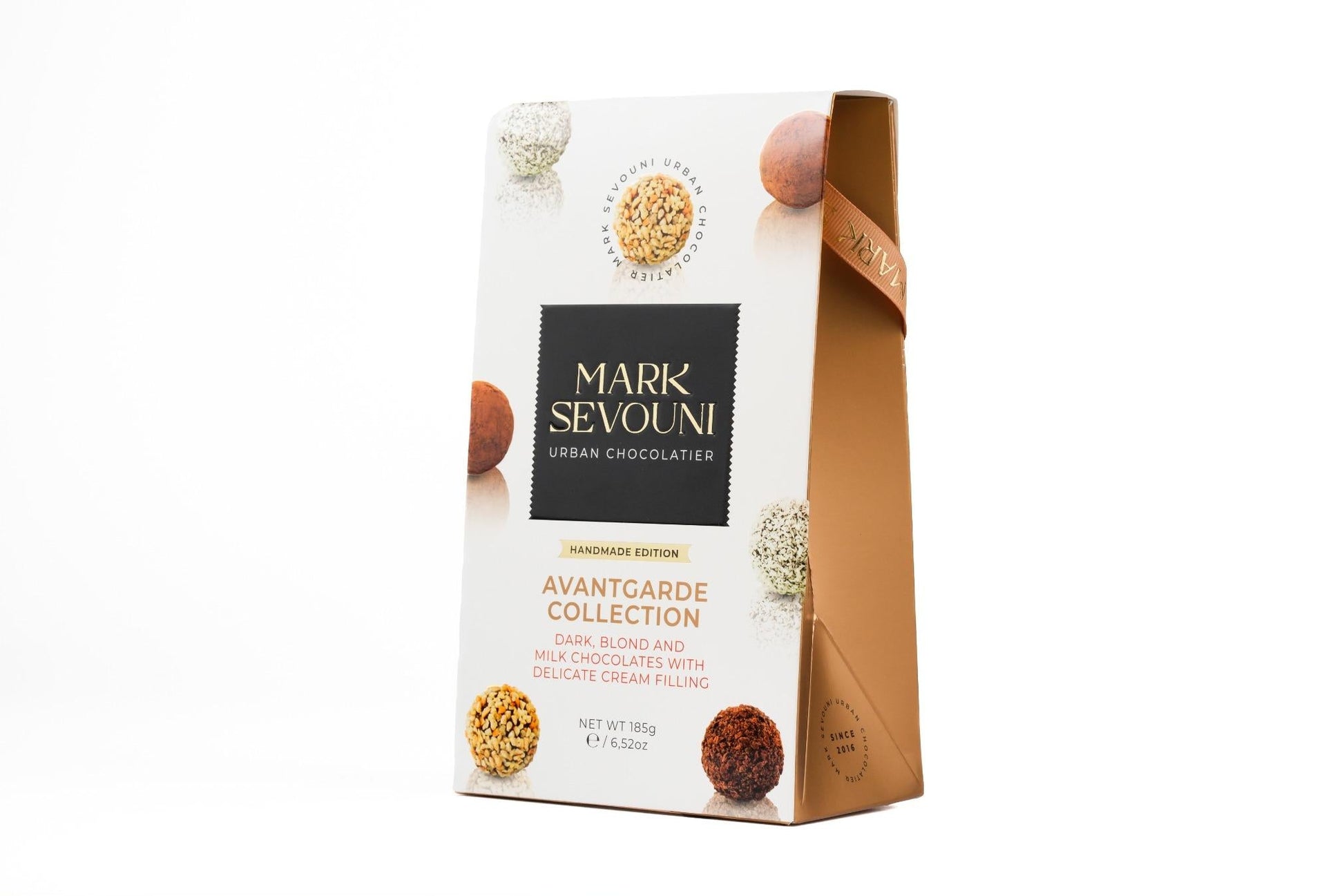 Mark Sevouni Avantgarde Collection chocolate truffle gift box – handmade dark, blond, and milk chocolates with delicate cream filling.