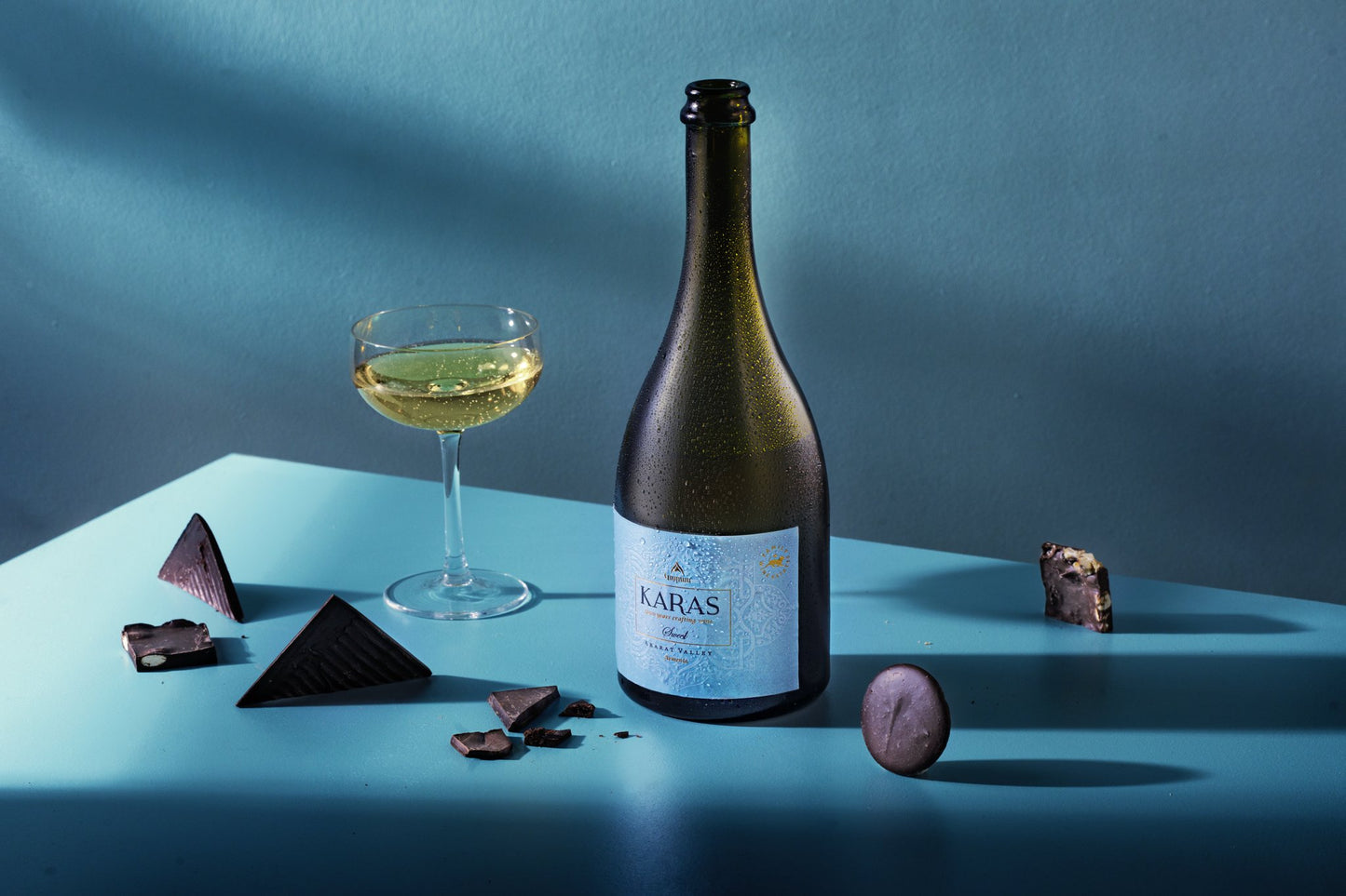 Karas Dyutich Sweet Sparkling Muscat 2023 wine bottle with gold foil and mountain-etched label.