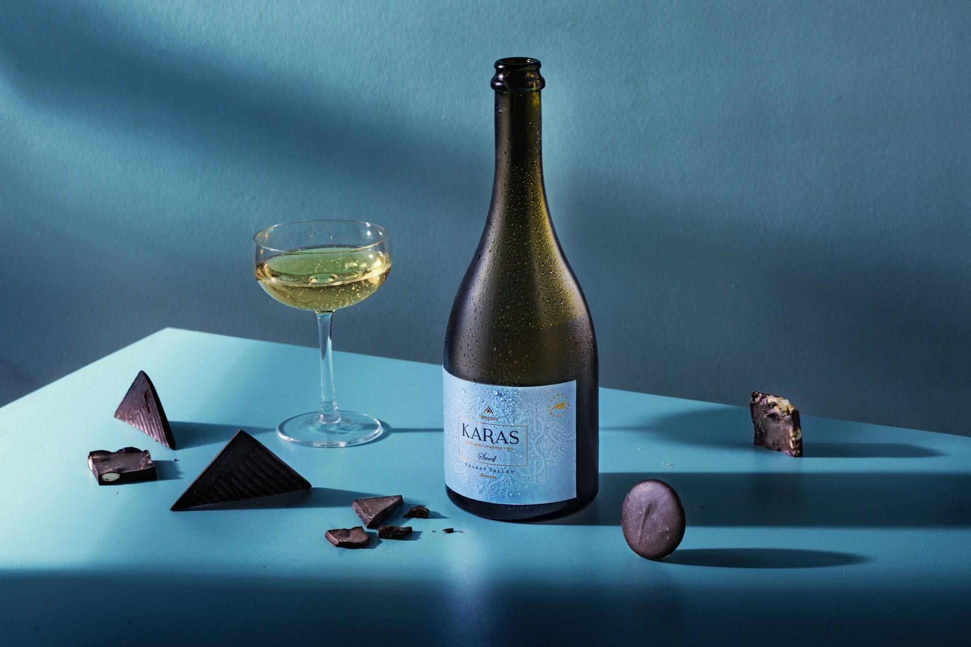 Karas Dyutich Sweet Sparkling Muscat 2023 wine bottle with gold foil and mountain-etched label.